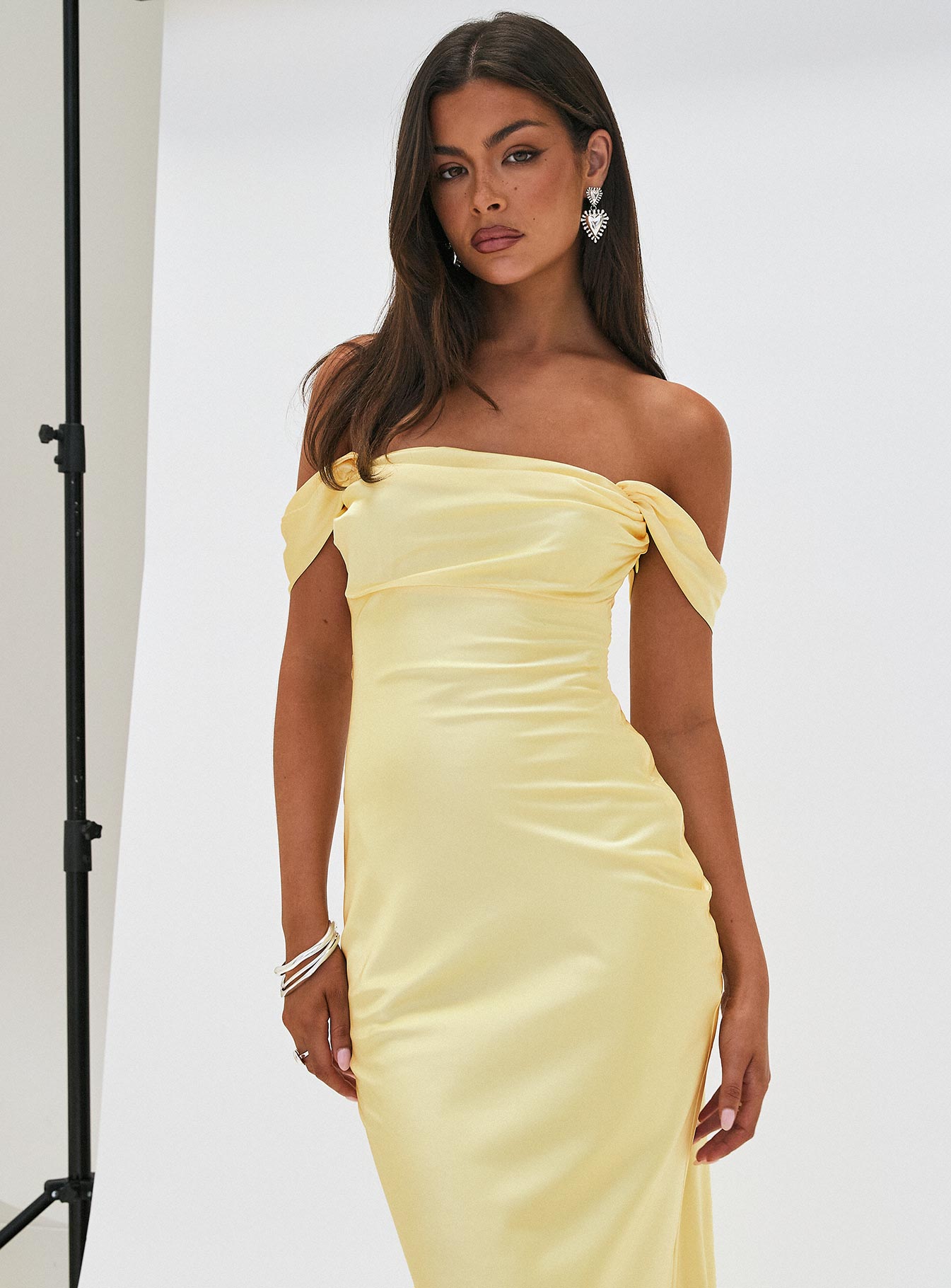 side view of model wearing Princess Polly Azura Off The Shoulder Maxi Dress Yellow Straight Neck 